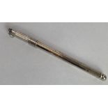 A silver swizzle stick, Birmingham 1953, with Coro