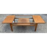 A mid 20th century G Plan coffee table with partia