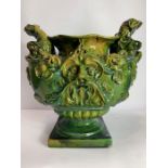 A 19th/20th century pottery two handled urn, the h