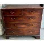 A Victorian mahogany veneer chest of two short and