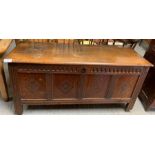 A 19th century stained oak coffer, the front panel