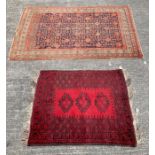 A 20th century wool rug, with three motifs to the