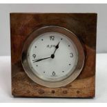 A Carrs silver hallmarked desk clock, the round in