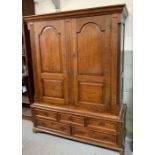 A 19th century oak cupboard, with moulded pendimen