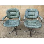 A pair of vintage hairdressers chairs, with chrome