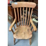 A 19th/20th century Windsor style armchair, with s