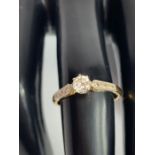 A diamond single stone ring, stamped ‘18ct & Plat’