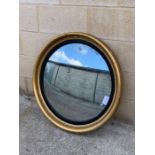 A large 20th century porthole type mirror, with wo