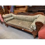 A Victorian mahogany framed sofa, with raised deco