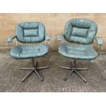 A pair of vintage hairdressers chairs