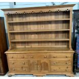 A large 20th century pine dresser, the top with de