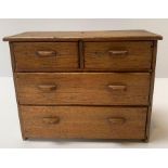 A 20th century oak apprentice miniature chest of t