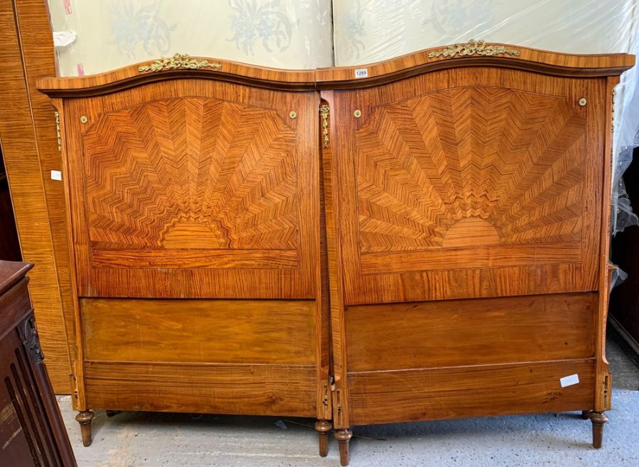 A pair of early 20th century French style veneered