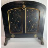 A 19th century ebonised fire screen, with rounded