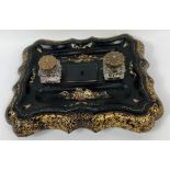 A Victorian shaped wooden desk stand, ebonised and