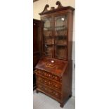 A 20th century mahogany veneered bookcase bureau,
