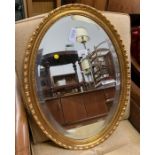 Gold framed oval mirror