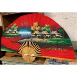 Large decorative red fan