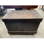Black painted wooden trunk on later casters