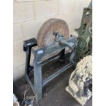 Milstone on metal stand, Harrison McGregor & Co Lt