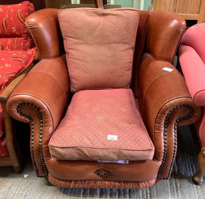 Vintage leather armchair with brass stud