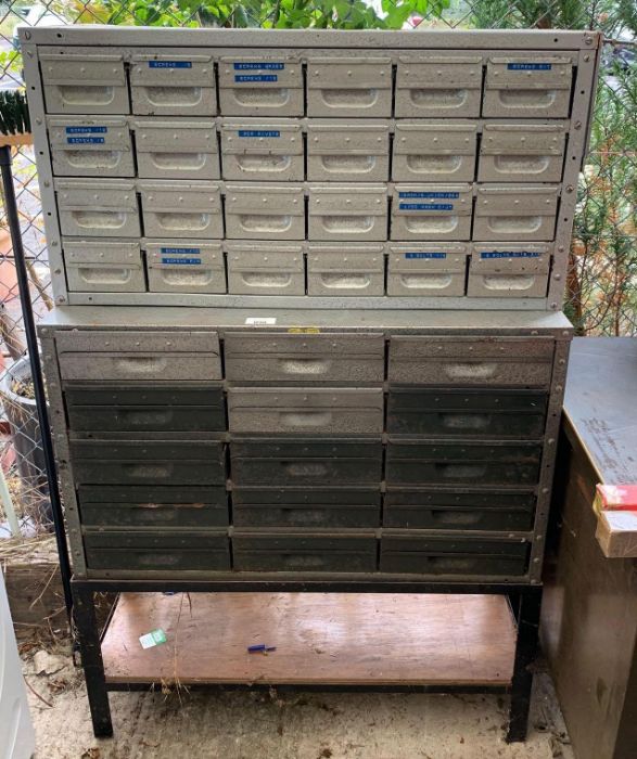 2 metal sets of drawers, some with contents