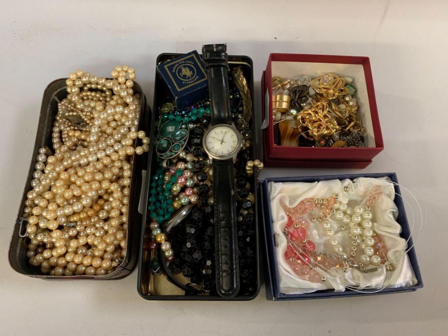 Shelf of costume jewellery, wristwatch, brooches e