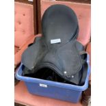 Blue plastic container with a saddle and bridle it