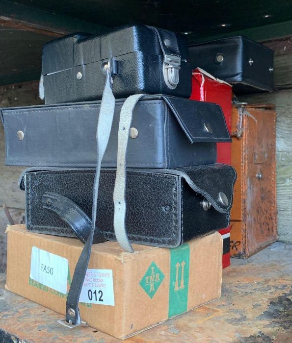 Half a shelf of boxed testing equipment