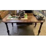 Early 20th century extending dining table on spiral legs & casters