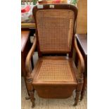 Commode chair with caned seat and back