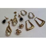 A collection of five pairs of earrings, of various
