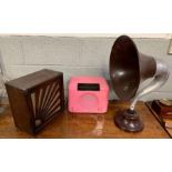A vintage radio horn speaker, along with two radio