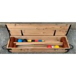 A vintage croquet set in a pine wooden box