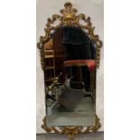 A 20th century wall mirror, with an ornate gilt me