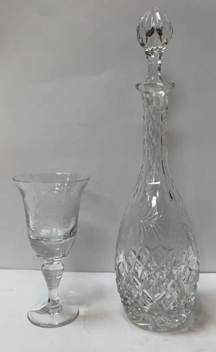 A heavy clear glass goblet, with an engraved decor