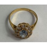 A cluster ring, stamped ‘750’, 3.2 g gross, finger