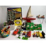 A collection of vintage toys including tin plate s