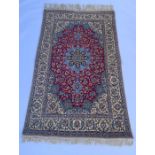 A Persian wool Isfhan rug, profusely