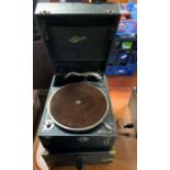 A vintage HMV record player and one other player