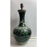 A late 19th century famille noire vase, converted to