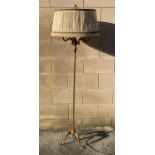 A 20th century reeded brass standard lamp, standin