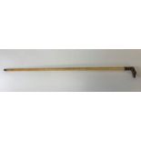 A 19th/20th century whale bone cane, the handle (p