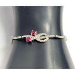 A ruby and diamond bracelet, the white metal stamp