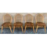 A set of four Ercol elm and beech chairs