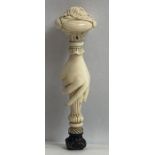 A 19th century ivory seal, carved with a hand