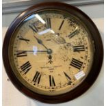 A genuine WWII 8 day military wall clock in a mahoga