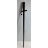 A 19th/20th century French bayonet, with oak and brass handle,