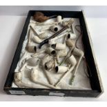 A collection of Victorian and later clay pipes, ma