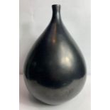 A large onion shaped vase, with a black matt glaze